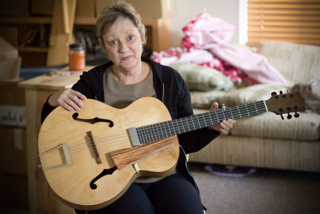 Mom, modeling my newly resurrected archtop guitar